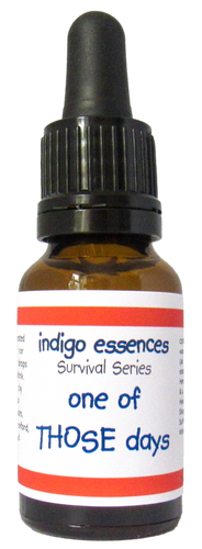Bottle of 'indigo essences' with a label reading 'one of THOSE days' on a white background
